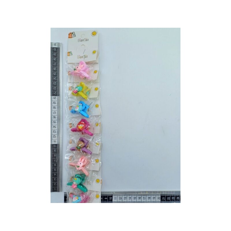 F – 009 pinza mini decorada variedad de personajes en tira C/10 HIQ-50